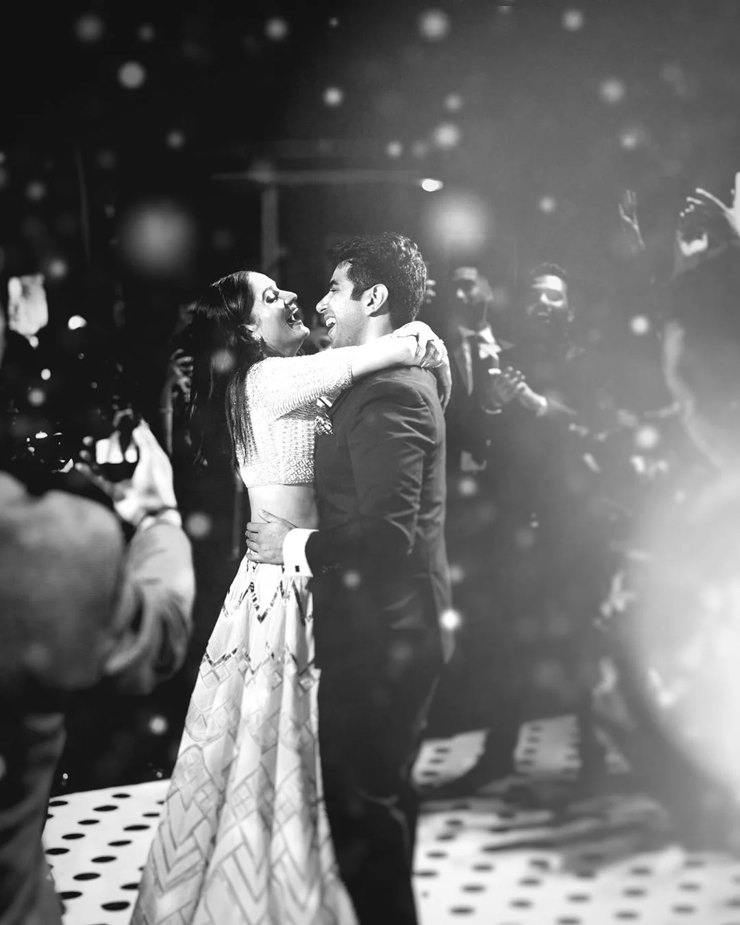 Couple dancing on sangeet black and white